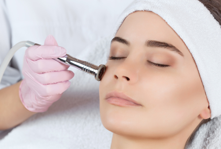 woman receiving facial treatment